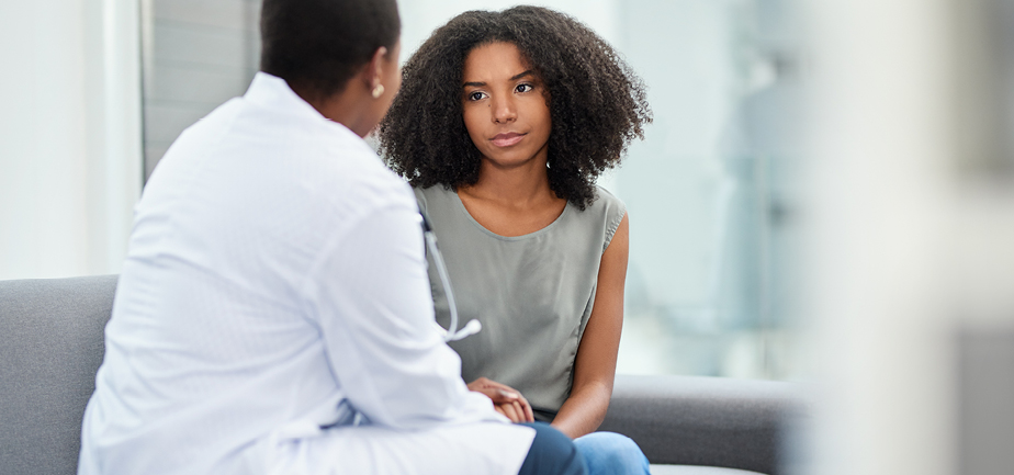 Shot of a young woman having a consultation with a doctor