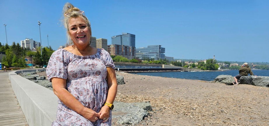 Carla Holmes standing on lakewalk in front of Duluth