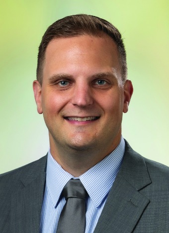 White male smiling at camera