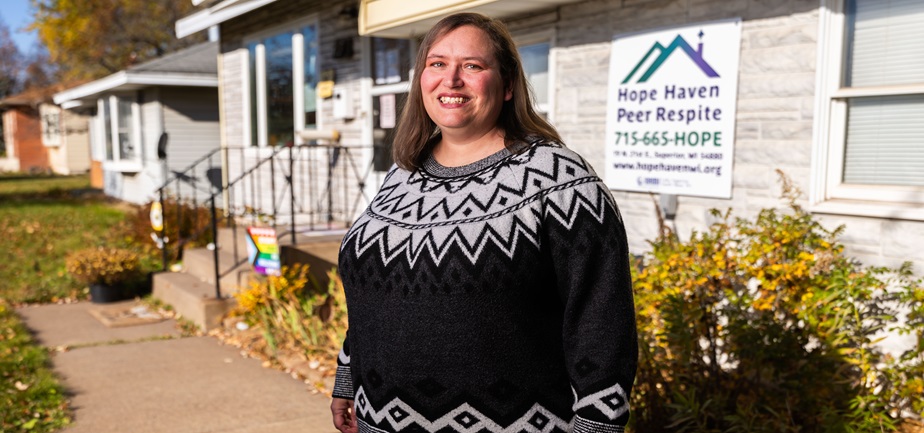 Chrissy Barnard poses in front of Hope Haven Peer Run Respite in Superior. “We use our own stories to give hope, not advice,” Barnard said of the work she and staff provide in the community.