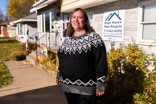 Chrissy Barnard poses in front of Hope Haven Peer Run Respite in Superior. “We use our own stories to give hope, not advice,” Barnard said of the work she and staff provide in the community.