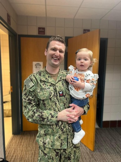 man holding young daughter