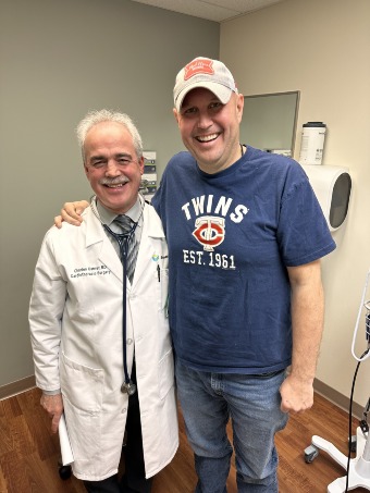 Doctor and Guy standing together