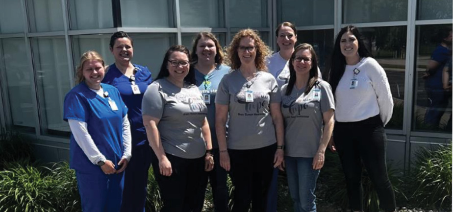 group of eight women in healthcare standing outside