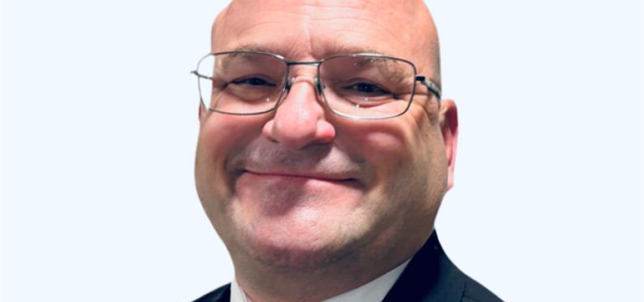 man with glasses smiling