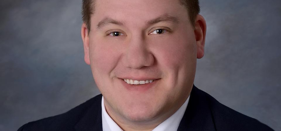 man in suit and tie smiling