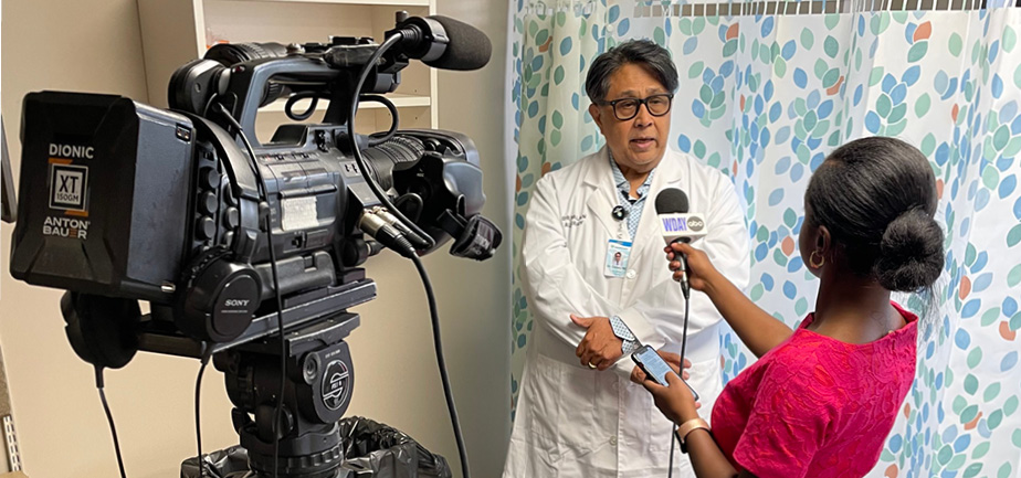 doctor interviewing with reporter