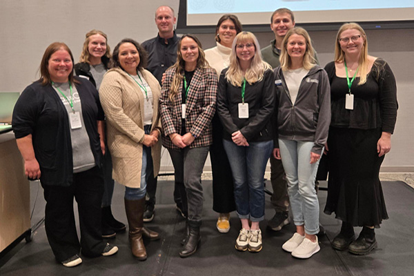 large group of people gathered for a photo indoors