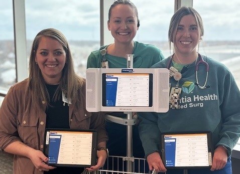 Essentia Health nursing manager Tiffany Cordell and RNs Darby Lien and Kirstyn Aldridge pose with iPads cued up to the language line app, which connects patients to a live interpreter