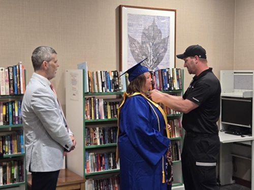 Ray Kordek watches Rebecca Johnson get pinned by her husband, Mitch Johnson