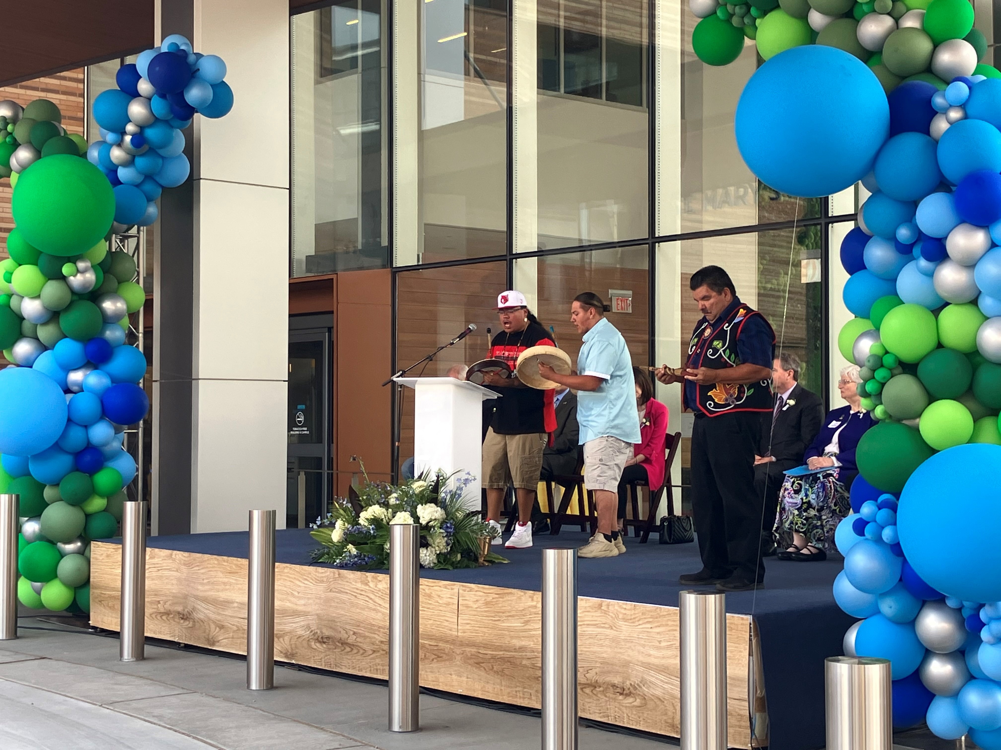 Three men playing instruments at VNL Opening ceremony