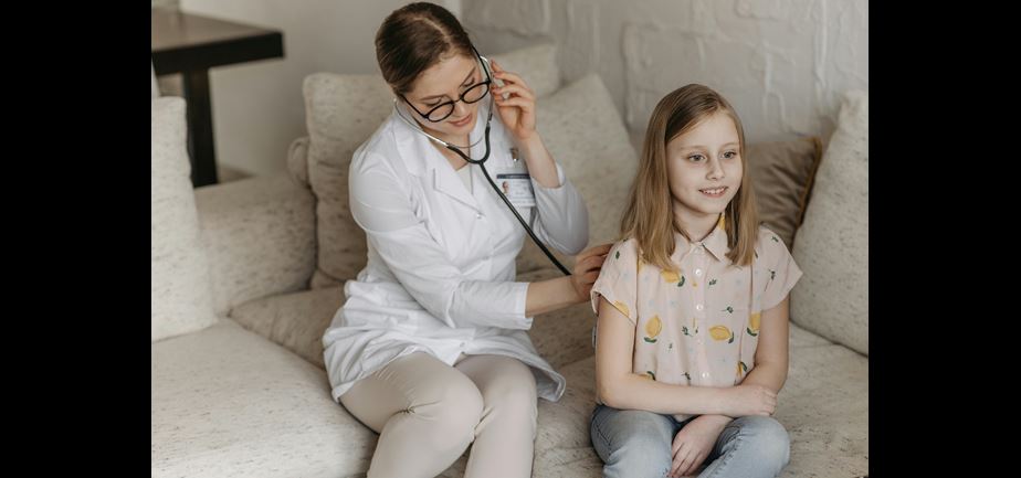Health care provider meeting with young child
