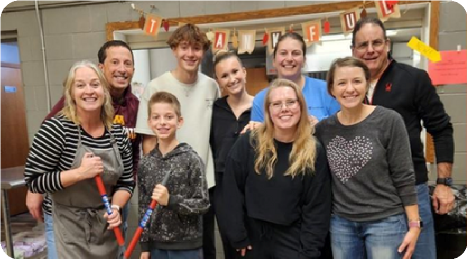 group of adults and kids all with smiling face
