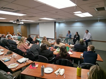 A group seated for a meeting