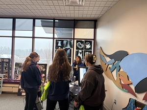 Essentia employees introducing 10th graders to hands-on learning activities