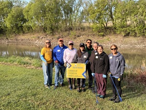 Essentia volunteers with a yellow banner