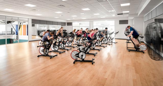people using exercise bikes