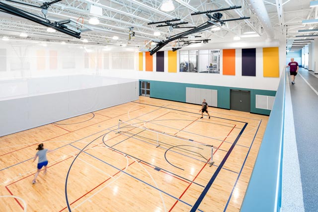 two people playing in a gymnasium