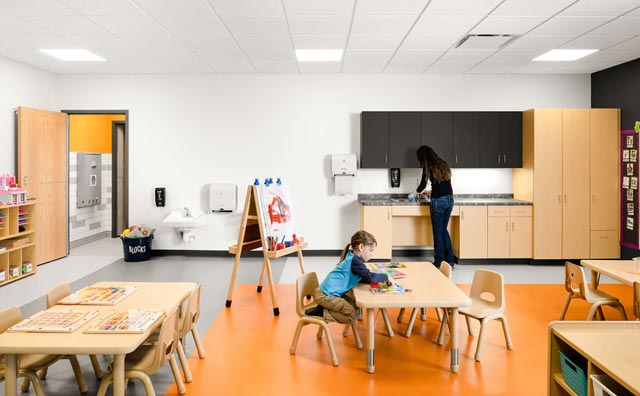 a kid playing at a table