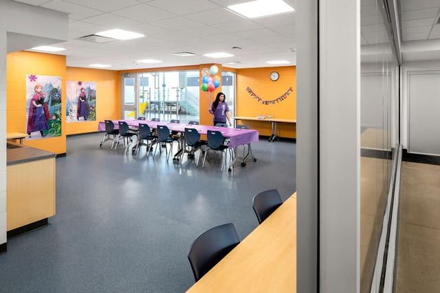 a room with a table and balloons